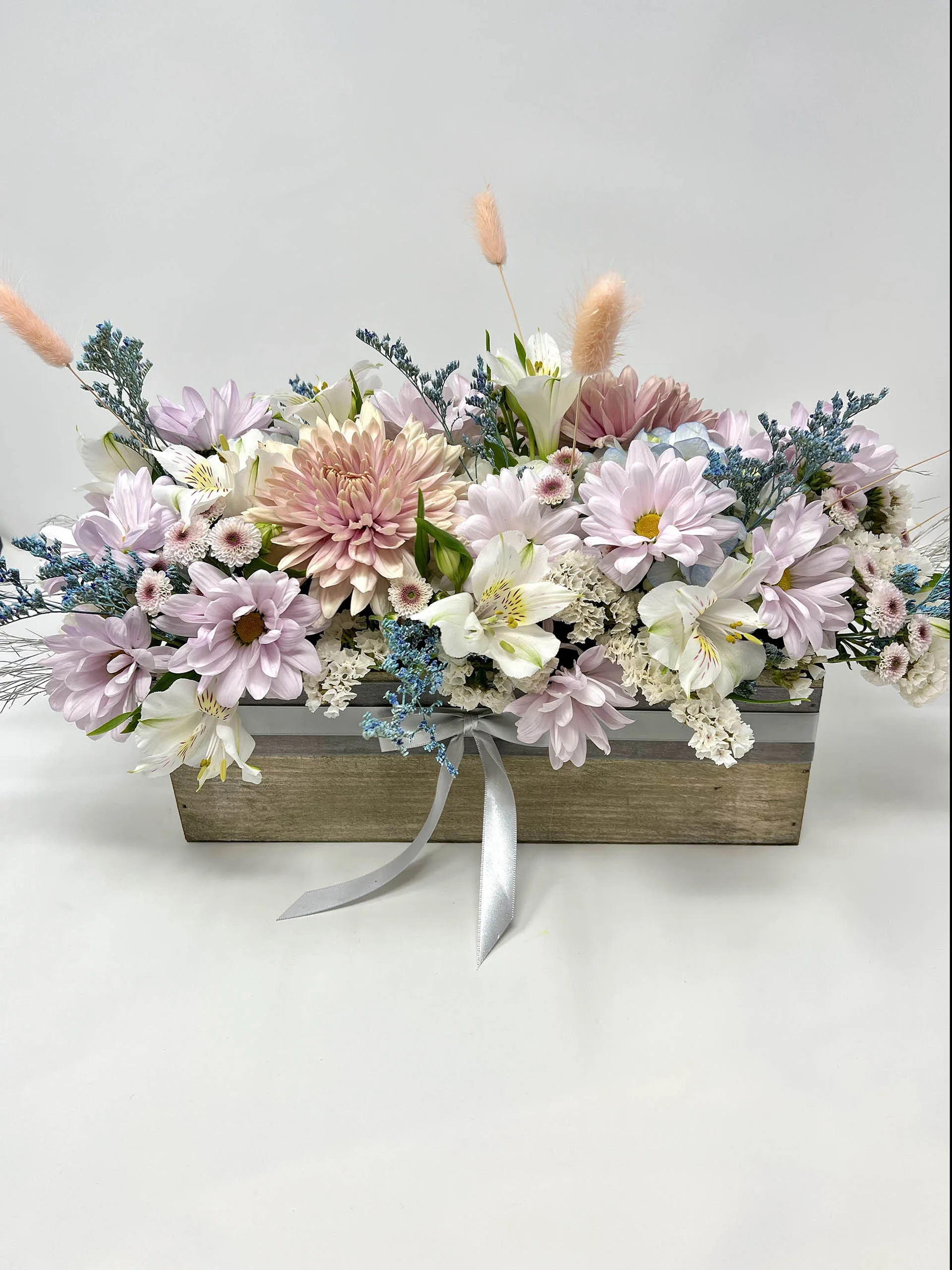 Pastel Serenity Centerpiece Arrangement with pink chrysanthemums, white alstroemeria in a wooden box