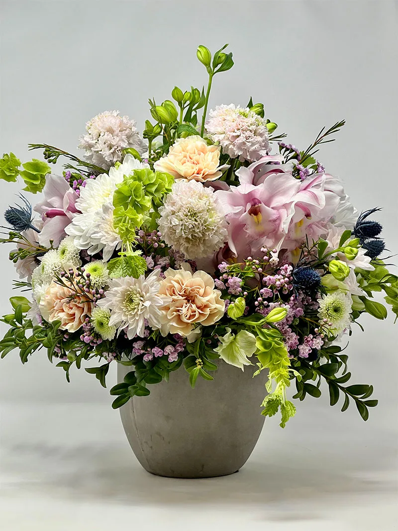 Pastel floral arrangement in a cement pot – Elegant centerpiece for home or office
