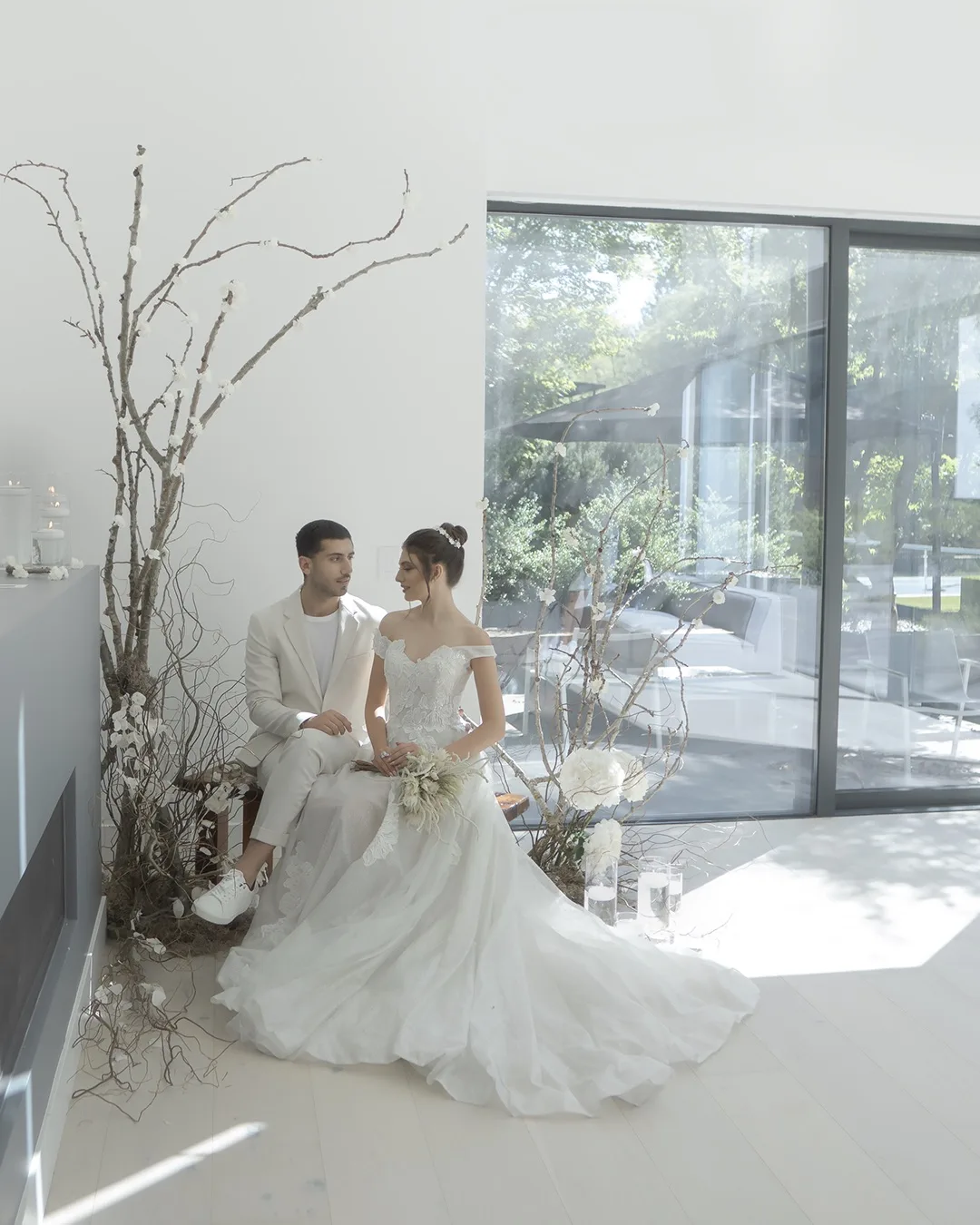 Modern Minimalist Wedding with Natural Floral Accents – Floba Flower Boutique Elegant bride and groom in a modern minimalist setting with white floral arrangements and natural wood accents, styled by Floba Flower Boutique in Vancouver.