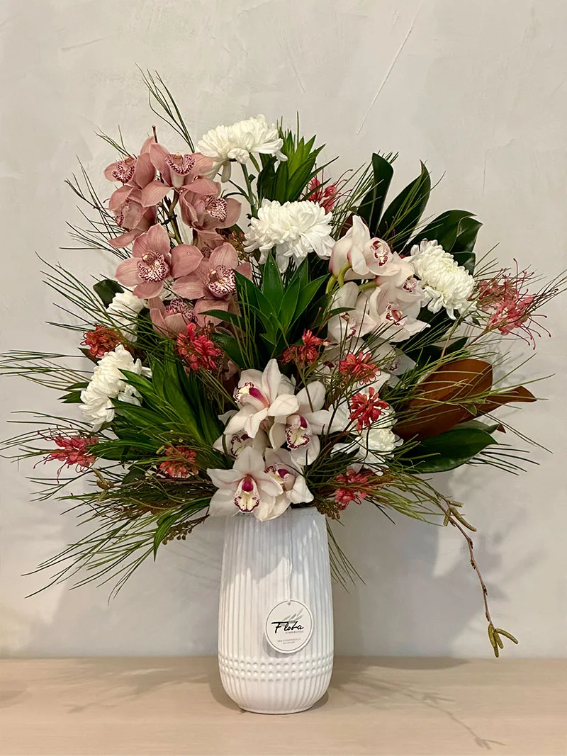 Orchid Grace Vase Arrangement with pink cymbidium orchids and white chrysanthemums in white vase