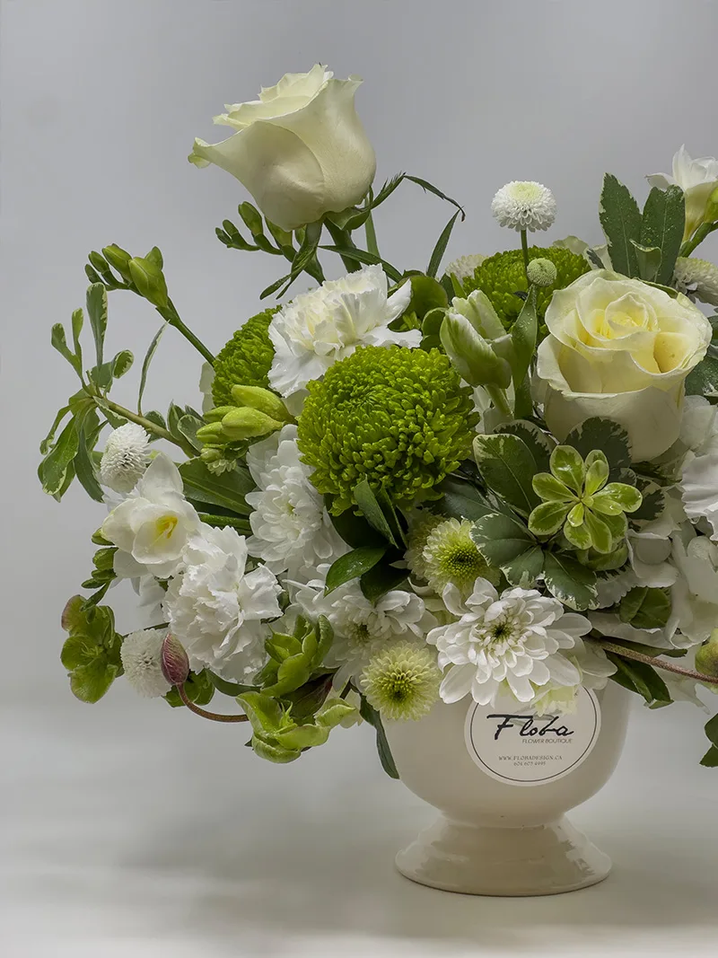 Close-up of Verdant Grace Arrangement with white roses and green chrysanthemums