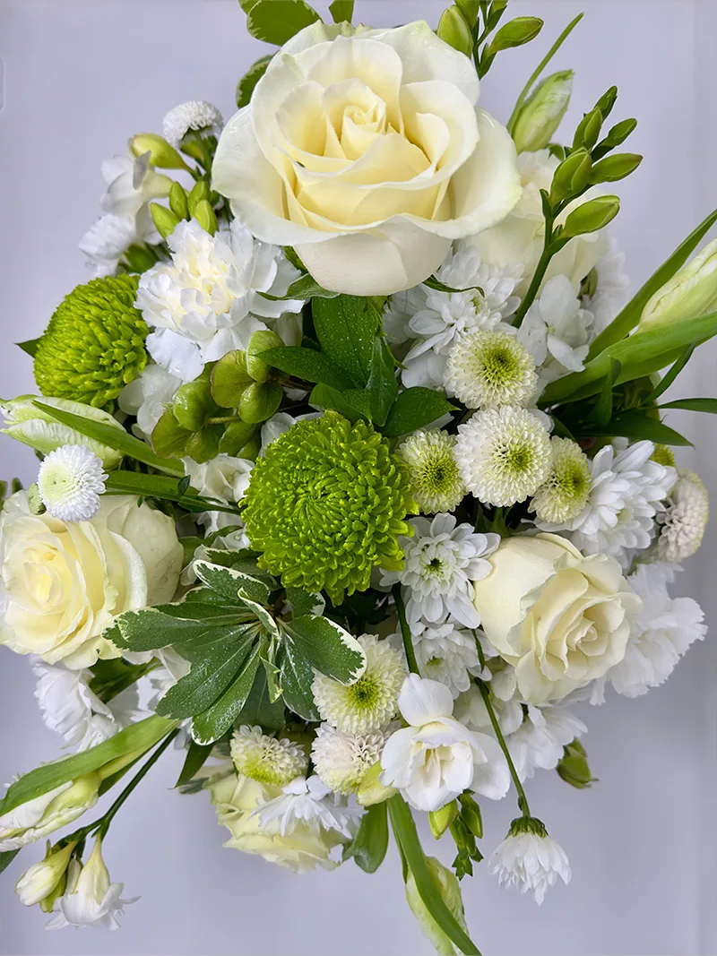 Overhead view of Verdant Grace Arrangement with white and green flowers