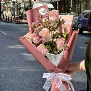 Blush Pink Rose Bouquet held on a Vancouver street by Floba Flower Boutique