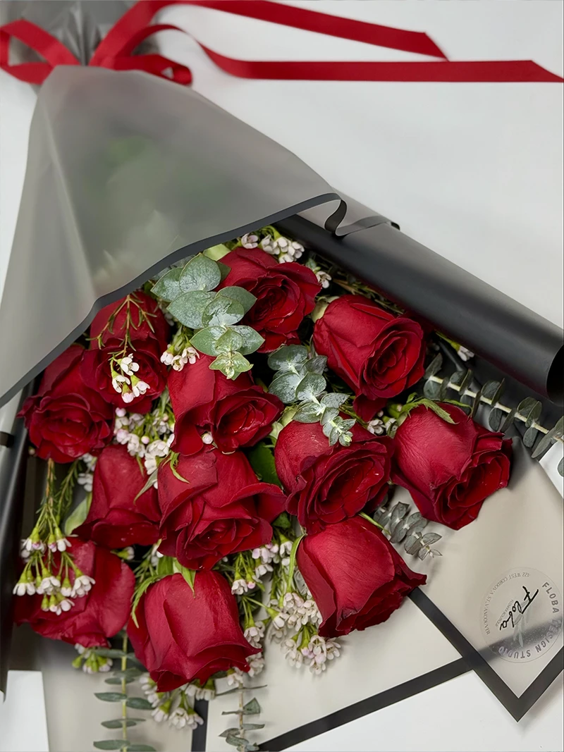 Eternal Scarlet Bouquet – Close-Up View Close-up of the Eternal Scarlet Bouquet with velvety red roses and lush greenery.