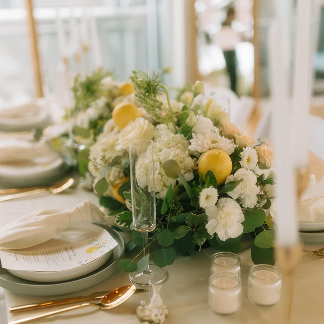 Elegant white and yellow event floral centerpiece with lemons – Vancouver