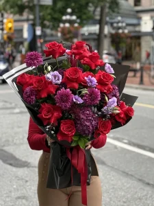 Romantic red rose and purple flower bouquet