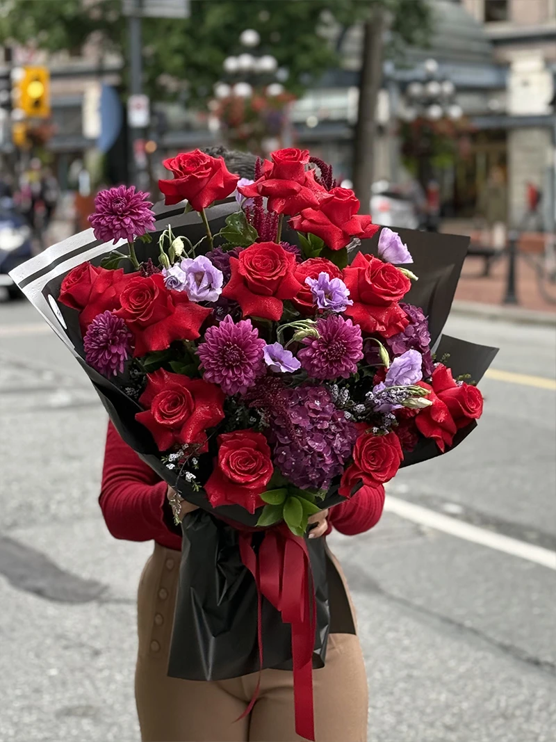 Romantic red rose and purple flower bouquet