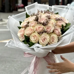 Blush and cream rose bouquet wrapped in white paper with pink ribbon – Floba Flower Boutique Vancouver