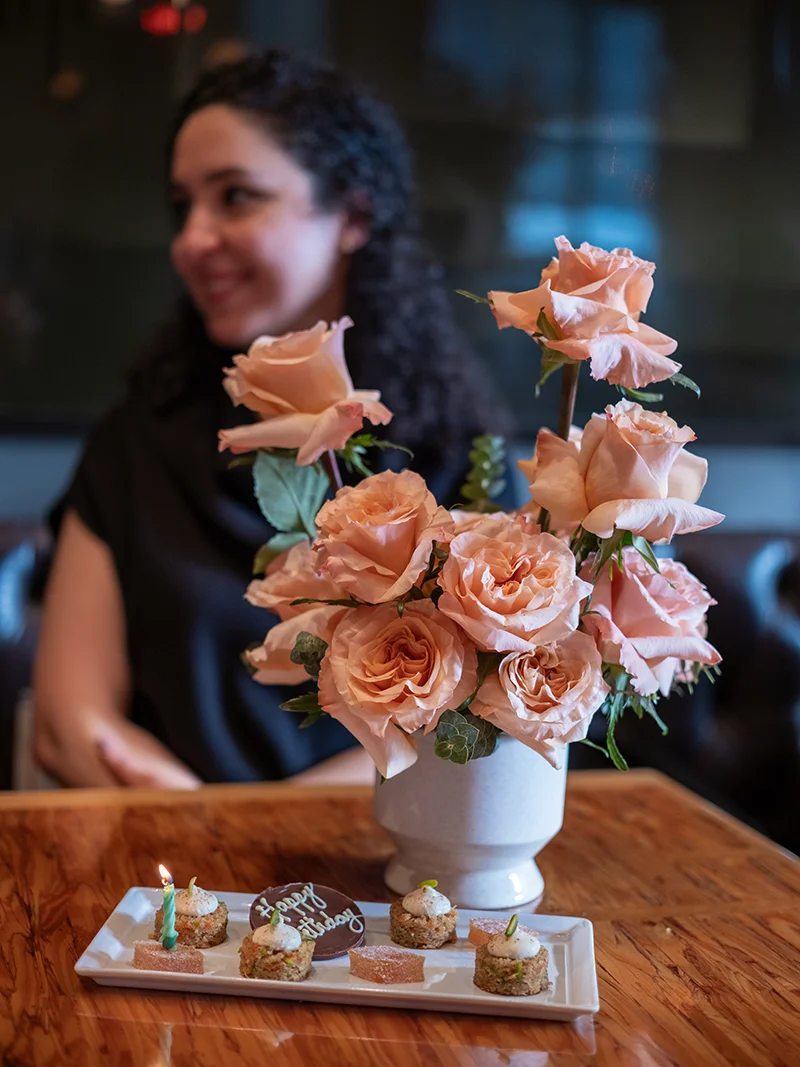Peach Rose Arrangement for Birthday or Celebration – Floba Vancouver Peach rose floral arrangement on café table in Vancouver