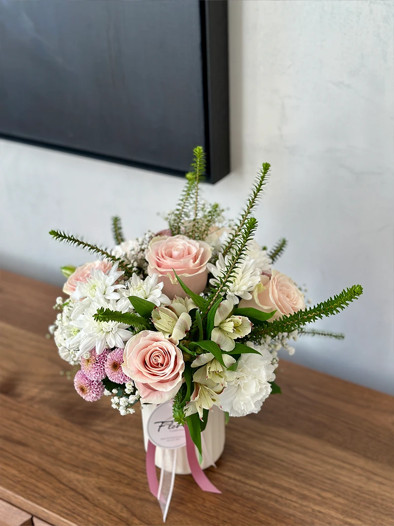 Elegant Pastel Floral Vase Elegant pastel floral vase with pink roses and fresh greenery