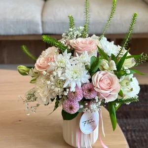 Pastel flower vase arrangement with blush roses and white flowers in Vancouver