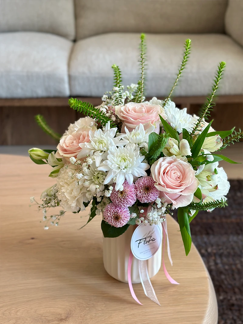 Pastel flower vase arrangement with blush roses and white flowers in Vancouver