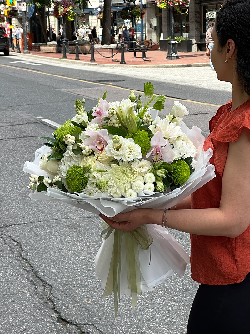 White and green bouquet with pink Cymbidium orchids, hydrangea, roses and chrysanthemums