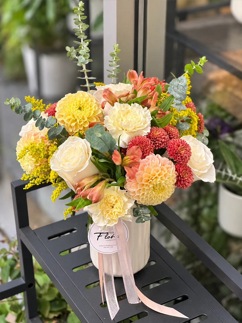 Peach Honey Flower Arrangement Top View View from above of the peach, cream, yellow and coral flowers in the Peach & Honey arrangement